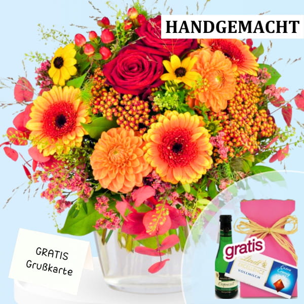 An autumn bouquet with orange Gerberas, red roses, Hypericum, and orange Dahlia blooms. Order online here.